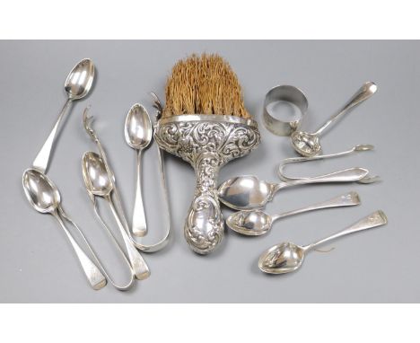 A pair of silver sugar tongs, various silver teaspoons, a sifter spoon, napkin ring and a silver-handled brush.
