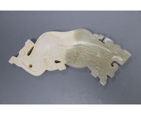 A Chinese archaistic pale celadon and calcified jade plaque
