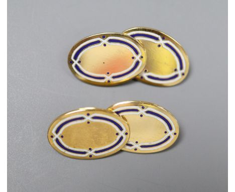 A pair of George V 18ct gold and two colour enamel oval cufflinks, gross 9.4 grams.