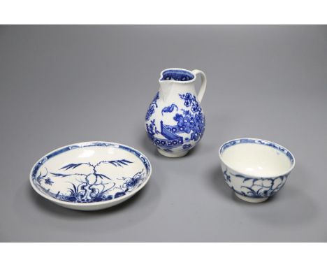A Worcester 'Candle Fence' tea bowl &amp; saucer, c.1765 and a 'The Bat' sparrow beak milk jug, c.1785,