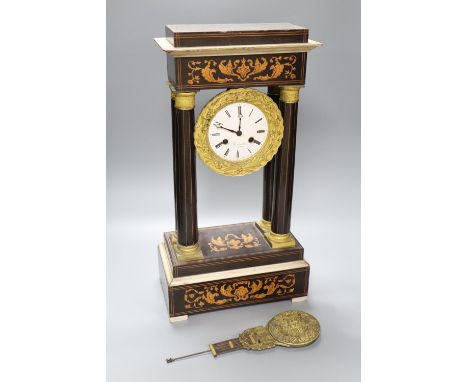 A 19th century inlaid French Portico mantel clock, with cast bacchus pendulum, 49cm