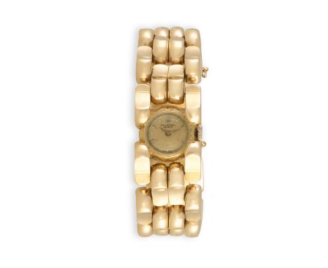 A LADY'S 18K GOLD MANUAL WIND RETRO BRACELET WATCH, BY UNIVERSAL, CIRCA 1940The Cal. 244 manual wind movement, champagne dial