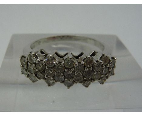 A white metal and diamond ring, weight 3.2g, size M
