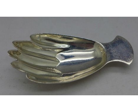 A novelty silver caddy spoon in the shape of a hand, Sheffield 1966