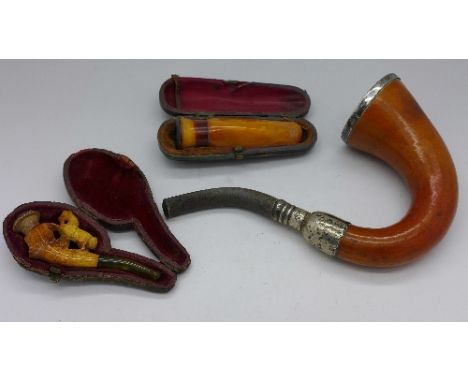 A silver mounted pipe and two cased cheroot holders
