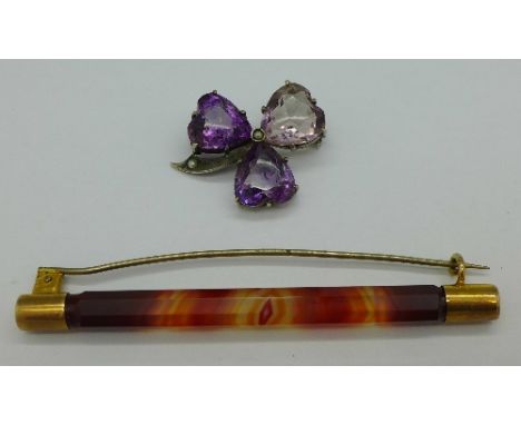 A yellow metal set Cairngorm brooch and a white metal amethyst stone and seed clover brooch
