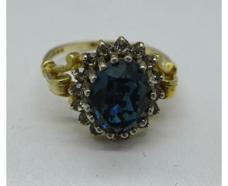 A silver and blue stone ring, size R
