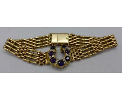 A 15ct gold bracelet with diamond and amethyst central horseshoe, weight 24.7g
