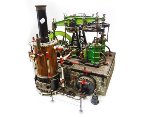 A scratch built twin double A frame paraffin fired beam engine, mounted on a base plate 18" x 18".  The boiler is paraffin fi