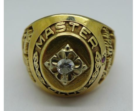 A 10k gold and diamond Master Club graduation style ring, weight 12.8g, size R