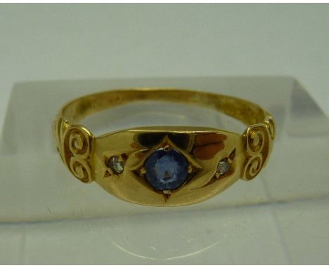 An 18ct gold, sapphire and diamond three stone ring, sapphire loose a/f, weight 1.5g, size M