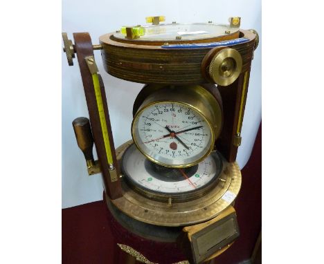 A Vernier azimuth, marina compass navigator with 24 hour bell watch and climate display with binnacle to the lower stand