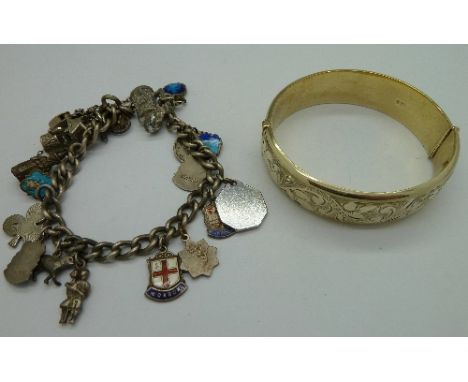 A silver charm bracelet and a silver gilt bangle, weight 69.4g