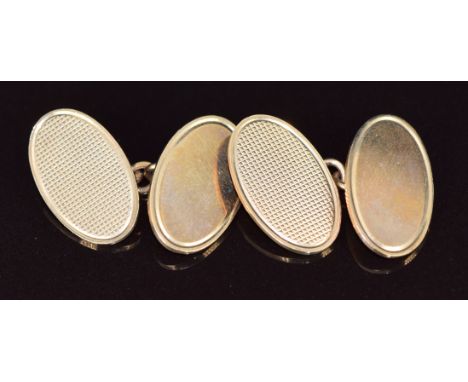 A pair of 9ct gold oval cufflinks with engine turned decoration, Birmingham 1986, maker&nbsp;Deakin &amp; Francis Ltd, weight