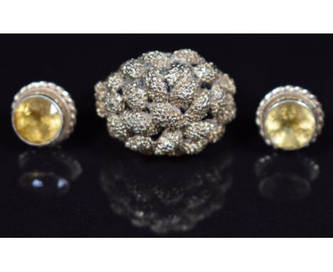 A 9ct gold ring with textured finish and a pair of 9ct gold earrings each set with a citrine, 7.4g, size L
