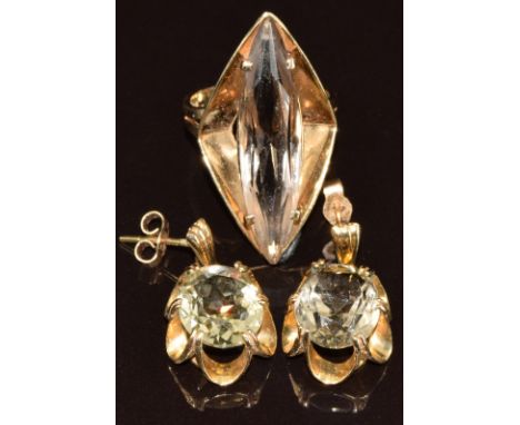 A 9ct gold ring set with a marquise cut smoky quartz and 9ct gold earrings set with oval smoky quartz, 10.7g, size M