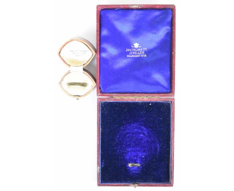 An antique tooled leather ring box in a marquise shape 'Mallett &amp; Son, The Octagon, Bath' and another antique watch/ jewe