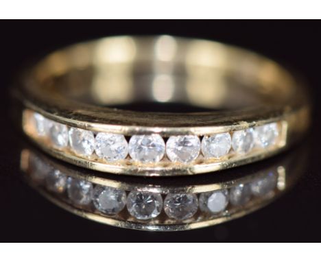 A 14k gold half eternity ring set with graduating round cut diamonds, 3g, size O