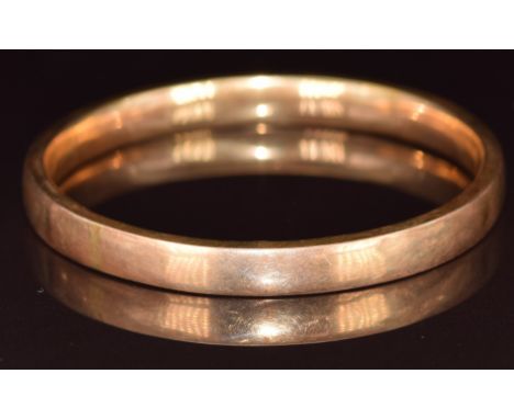 A yellow metal bangle marked 18k, 12.3g, 7cm&nbsp;
