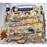 A collection of jewellery including silver bracelets, silver earrings, brooches, beads, collection