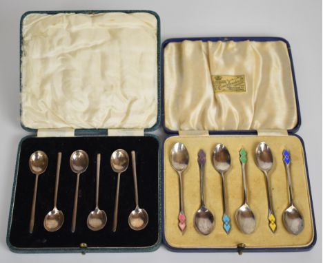 Two cased sets of six Art Deco hallmarked silver tea or coffee spoons, one set with enamel decoration, Birmingham 1937, maker