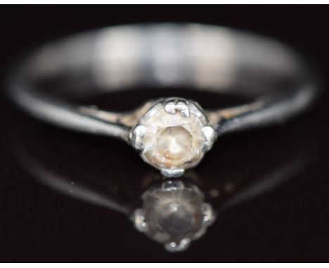 A platinum ring set with a white sapphire, 2.2g, size M