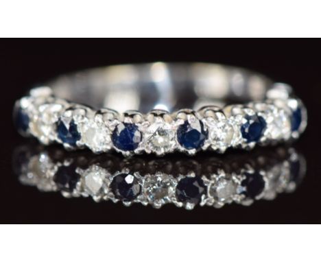 An 18ct white gold half eternity ring set with alternating sapphires and diamonds, 3.1g, size R&nbsp;