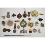 A collection of brooches/ medallions including hammered Arts & Crafts, enamelled 'sciencias letras e