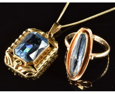 A 14k gold ring set with aquamarine (size M) and a 14k gold pendant set with an emerald mixed cut aquamarine of approximately