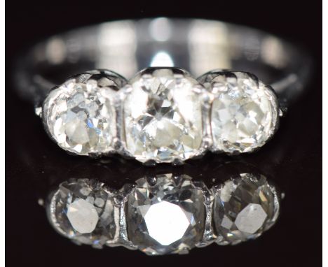 A platinum ring set with three old cut diamonds of approximately 0.5ct, 0.25ct & 0.3ct, 2.6g, size L  