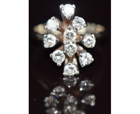 A 14k white gold ring set with ten round cut diamonds, each approximately 0.08ct in a cluster, 3.1g, size J