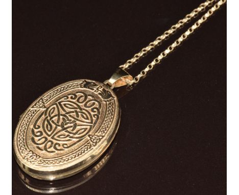 A 9ct gold locket with embossed Celtic decoration (4.4cm) on 9ct gold chain, 8.8g, 60cm