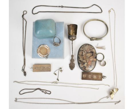 A collection of silver jewellery including two ingots, ring set with marcasite, pendant, bangle in the form of a buckle, two 