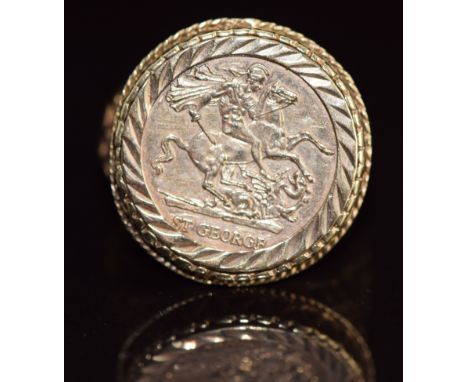 A 9ct gold ring set with a plaque of St George, 6.9g, size Y