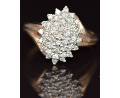 A 9ct gold ring set with diamonds in a cluster, 5.1g, size S