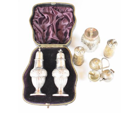 Hallmarked silver peppers and similar condiments to include a cased pair of Victorian peppers, Birmingham 1892, maker's mark 