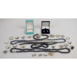A collection of silver jewellery including 18 rings and six pairs of earrings, together with two