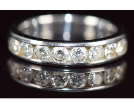 An 18k white gold half eternity ring set with eight round cut diamonds, the total diamond weight approximately&nbsp;1ct, 6.8g