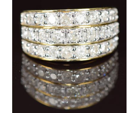 A 10k gold ring set with three rows of diamonds, 5g, size N