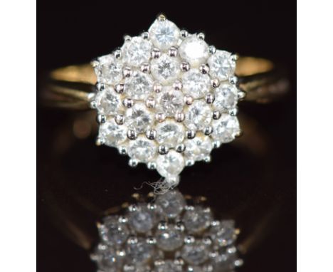 A 9ct gold ring set with a cluster of diamonds, the total diamond weight approximately 1ct, size O