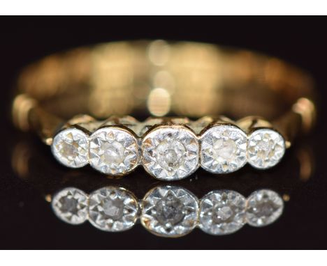 An 18ct gold ring set with five graduated diamonds in a platinum setting, 1.9g, size O