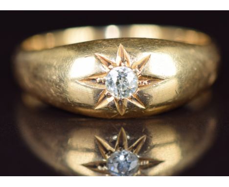 An 18ct gold ring set with an old cut diamond of approximately 0.12ct&nbsp;in a star setting, Birmingham 1919, 6.2g, size R