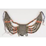 Yemenite tribal necklace made up of white metal and coral coloured glass beads