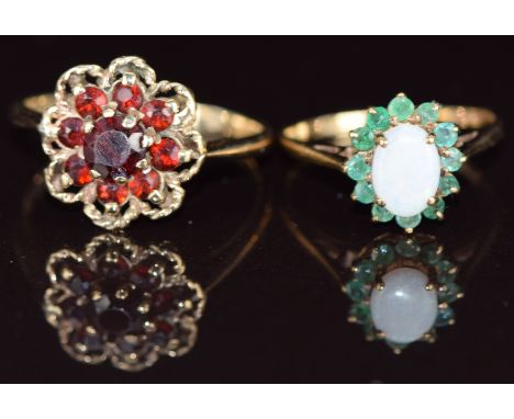 Two 9ct gold rings, one set with a cluster of garnets and the other an opal surrounded by emeralds, 3.8g, sizes J &amp; Q