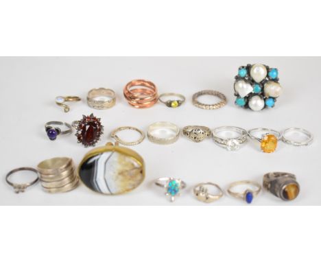 Twenty silver rings including tiger's eye, garnet, amethyst, pearl and turquoise, etc and a large agate ring&nbsp;