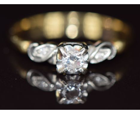 An 18ct gold ring set with a diamond of approximately 0.18ct in a platinum setting, 2.9g, size T