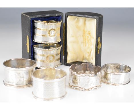 Six various hallmarked silver napkin rings including a cased pair with engine turned decoration, weight 109g