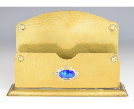 Liberty style Arts and Crafts or Art Nouveau brass letter rack with hammered decoration and central enamel cabochon, marked t