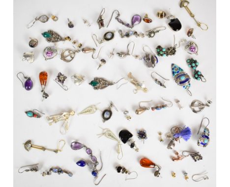 A collection of silver/ white metal earrings including amethyst, garnet, enamel, amber, etc, 130g&nbsp;