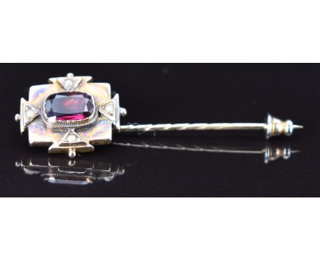 A 9ct gold stick pin set with a foiled garnet and seed pearls, 4g, 5.5cm
